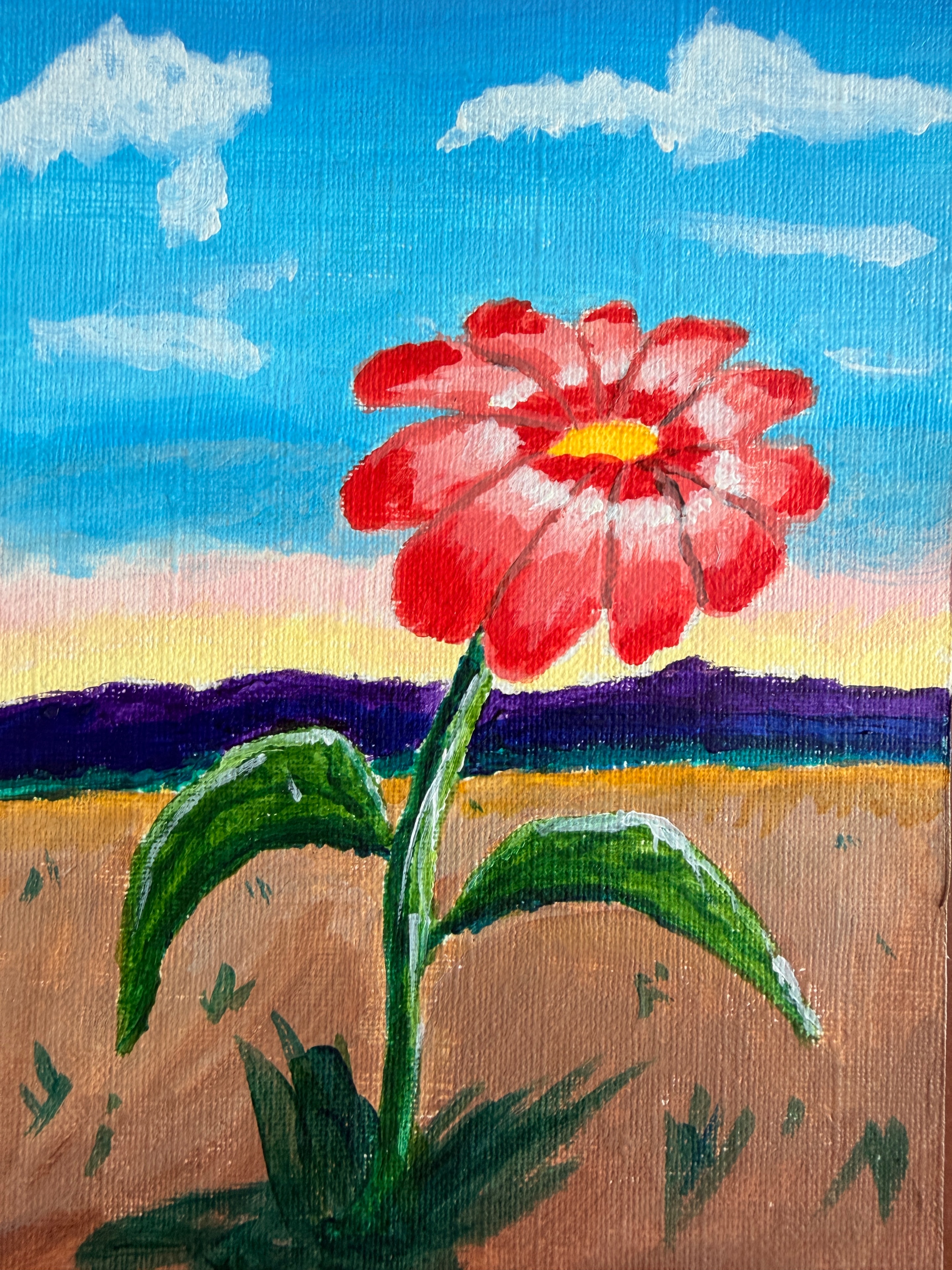 Painted red flower near a window with blue sky and green leaves